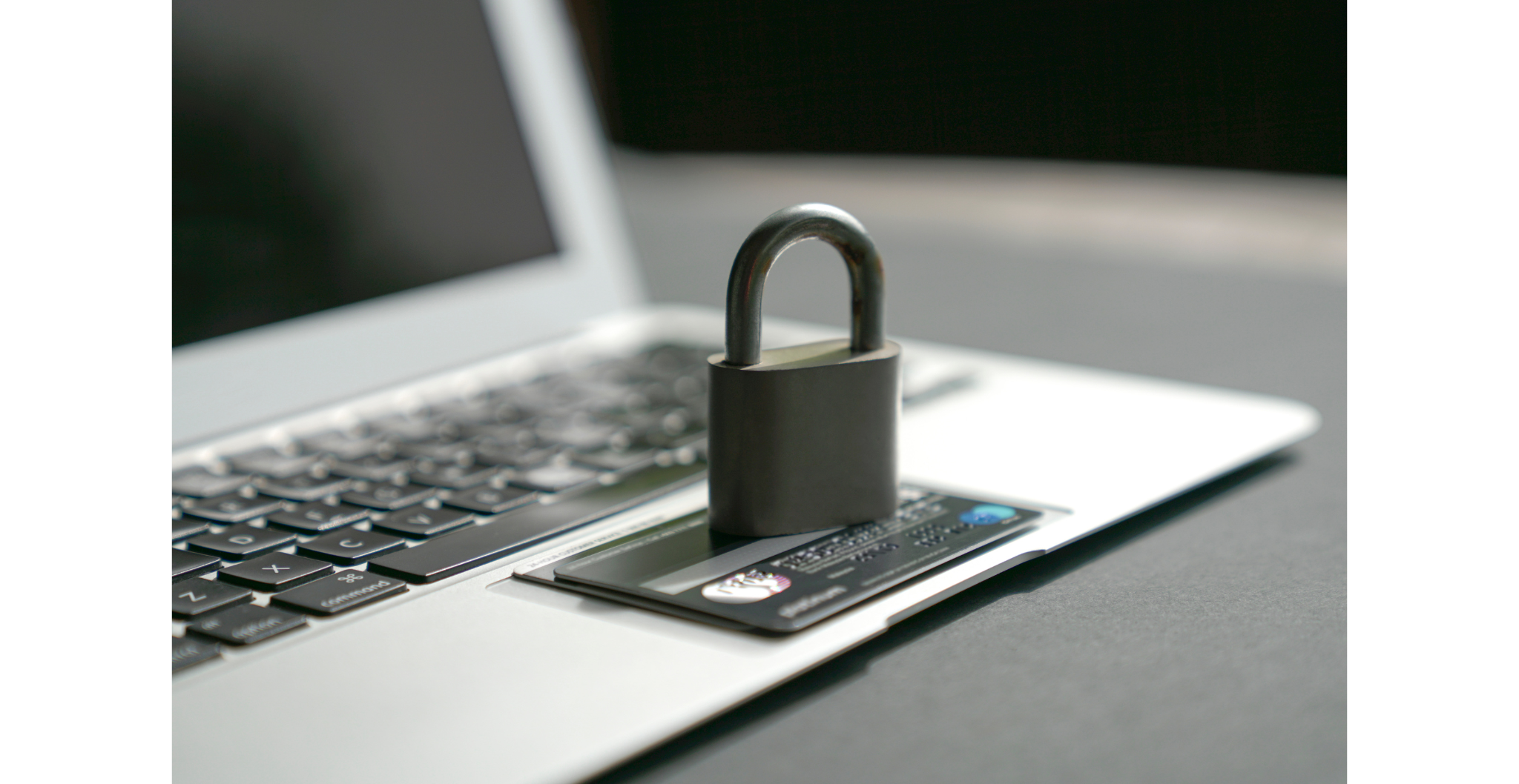 Padlock resting on laptop keyboard, representing cybersecurity and PSD3 regulation.