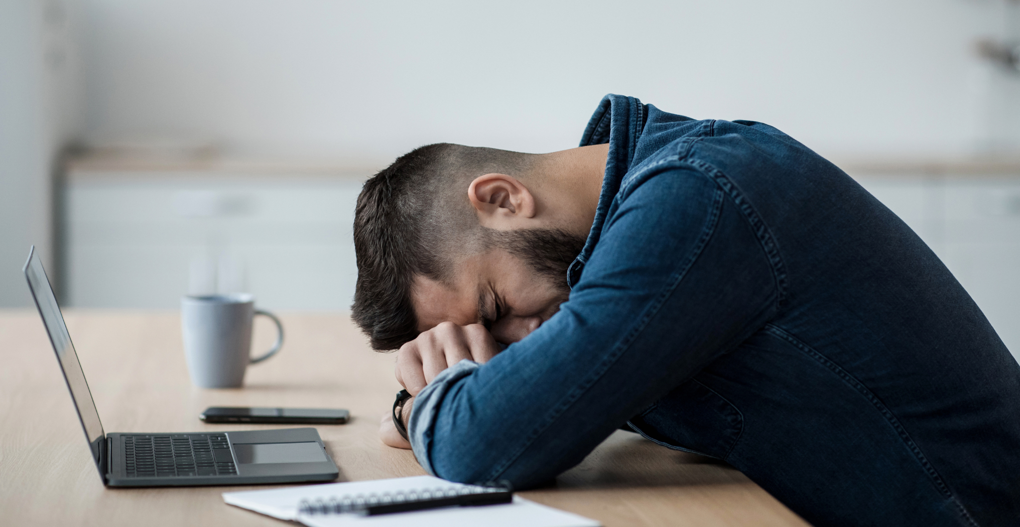E-commerce owner stressed at laptop after outgrowing payment provider